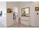Inviting entryway with tile flooring, white walls, and decorative art leading to a playroom at 2021 Pelican Sky Beach Ave, North Las Vegas, NV 89081