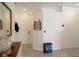 Bright entryway with a white door, tile flooring, and neutral decor at 2021 Pelican Sky Beach Ave, North Las Vegas, NV 89081
