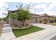 Charming single-story home with a well-manicured lawn and inviting curb appeal at 2021 Pelican Sky Beach Ave, North Las Vegas, NV 89081