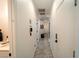 Hallway showcasing clean lines and neutral tones, leading to various rooms in the house at 2021 Pelican Sky Beach Ave, North Las Vegas, NV 89081