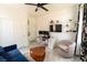 Functional home office featuring a desk with dual monitors, floating shelves, and a cozy chair at 2021 Pelican Sky Beach Ave, North Las Vegas, NV 89081