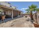 Spacious backyard with a covered patio, perfect for outdoor entertaining and relaxation at 2147 Bridle Wreath Ln, Las Vegas, NV 89156