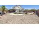 Sprawling backyard with an in-ground pool, covered patio, and mature landscaping, ready for your personal touch at 2147 Bridle Wreath Ln, Las Vegas, NV 89156