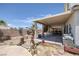 Charming backyard with a covered patio, perfect for outdoor entertaining and relaxation in a private setting at 2147 Bridle Wreath Ln, Las Vegas, NV 89156