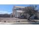 Charming two-story home features a tile roof and well-manicured landscaping at 2147 Bridle Wreath Ln, Las Vegas, NV 89156