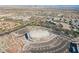 Aerial view of the community area offering expansive roadways, lush greenbelts, parking and desert landscape at 2201 Ramsgate Dr # 327, Henderson, NV 89074