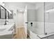 Bathroom features double sinks, quartz countertops, black fixtures, and a soaking tub at 2201 Ramsgate Dr # 327, Henderson, NV 89074