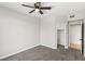 Bedroom features carpet floors, a ceiling fan, closet, and access to an adjoining door at 2201 Ramsgate Dr # 327, Henderson, NV 89074