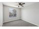Bedroom features carpet floors, a ceiling fan, and a window that provides natural light at 2201 Ramsgate Dr # 327, Henderson, NV 89074