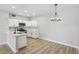 Charming kitchen featuring bright white cabinets and modern stainless steel appliances at 2201 Ramsgate Dr # 327, Henderson, NV 89074