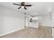 Inviting living room flows into a stylish kitchen, complemented by light wood floors at 2201 Ramsgate Dr # 327, Henderson, NV 89074