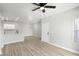 Spacious living area with light wood floors, seamlessly connecting to a modern kitchen at 2201 Ramsgate Dr # 327, Henderson, NV 89074