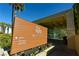 An elegant community spa sign featuring fitness center and directional arrows with desert landscaping at 2201 Ramsgate Dr # 327, Henderson, NV 89074