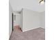 Comfortable bedroom with carpeted flooring and an open doorway to the rest of the home at 2240 Sky Island Dr, Henderson, NV 89002
