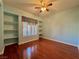 Bedroom featuring hardwood floors, bright window and built in shelves at 2343 Scotch Lake St, Las Vegas, NV 89134