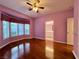 Bedroom with hardwood floors, shutters, and en-suite bathroom at 2343 Scotch Lake St, Las Vegas, NV 89134