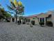 Home exterior featuring neutral tones, desert landscaping and spacious covered patio at 2343 Scotch Lake St, Las Vegas, NV 89134