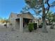 Home exterior featuring desert landscaping, covered porch and charming design at 2343 Scotch Lake St, Las Vegas, NV 89134