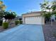 Single-story home featuring an attached two-car garage and concrete driveway at 2343 Scotch Lake St, Las Vegas, NV 89134