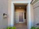Close-up of the front doorway with a tiled entrance and dark door at 2343 Scotch Lake St, Las Vegas, NV 89134