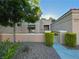 Single-story home with rock landscaping, desert foliage, and a gated front entry at 2343 Scotch Lake St, Las Vegas, NV 89134