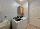 Laundry room featuring washer, dryer, utility sink and storage cabinet at 2343 Scotch Lake St, Las Vegas, NV 89134