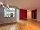 Bright living space with hardwood floors adjacent to a kitchen with stainless steel appliances at 2343 Scotch Lake St, Las Vegas, NV 89134