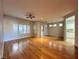 Open-concept living room with hardwood floors, large windows, and abundant natural light at 2343 Scotch Lake St, Las Vegas, NV 89134