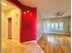 Bright living room with hardwood floors and unique accent wall at 2343 Scotch Lake St, Las Vegas, NV 89134