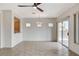 Open dining area featuring tile floors, modern light fixture, and sliding door access to the backyard at 2804 Sapphire Desert Dr, Henderson, NV 89052