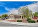 Single-story home with mature landscaping, two-car garage, and well-maintained lawn at 2804 Sapphire Desert Dr, Henderson, NV 89052