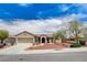 Charming single-story home with desert landscaping, beautiful trees, and a two-car garage at 2804 Sapphire Desert Dr, Henderson, NV 89052