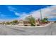 Corner-lot home featuring desert landscaping, a two-car garage, and well-maintained shrubs at 2804 Sapphire Desert Dr, Henderson, NV 89052