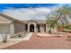 Tan single-story home featuring desert landscaping and a two-car garage at 2804 Sapphire Desert Dr, Henderson, NV 89052