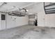 Spacious two car garage with overhead storage, cabinets, and utility sink at 2804 Sapphire Desert Dr, Henderson, NV 89052
