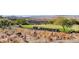 Scenic view of a golf course with golf carts and desert landscaping at 2804 Sapphire Desert Dr, Henderson, NV 89052