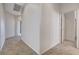Hallway featuring tile floors and views into multiple rooms at 2804 Sapphire Desert Dr, Henderson, NV 89052