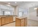 Kitchen with tile floors, center island and views to breakfast nook and living room at 2804 Sapphire Desert Dr, Henderson, NV 89052