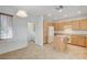 Well-lit kitchen with tile floors, oak cabinets and a convenient island at 2804 Sapphire Desert Dr, Henderson, NV 89052