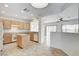 Bright kitchen with light wood cabinets, a center island, and tile flooring at 2804 Sapphire Desert Dr, Henderson, NV 89052