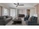 Bright living room featuring stylish furnishings, a ceiling fan, and natural light at 2804 Sapphire Desert Dr, Henderson, NV 89052