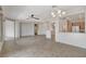 Large living area showcasing tile flooring, open layout to the kitchen, and modern fixtures at 2804 Sapphire Desert Dr, Henderson, NV 89052