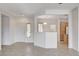 Open concept living room with neutral paint, tile flooring, and views into the kitchen area at 2804 Sapphire Desert Dr, Henderson, NV 89052