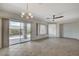 Open living area with tiled floors, a chandelier, and sliding glass door to the backyard patio at 2804 Sapphire Desert Dr, Henderson, NV 89052