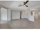 Spacious living area with tile floors, neutral walls, and an open layout to adjoining rooms at 2804 Sapphire Desert Dr, Henderson, NV 89052