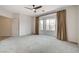 Large main bedroom offers plush carpet, a ceiling fan, and a view of a bay window at 2804 Sapphire Desert Dr, Henderson, NV 89052