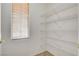 Walk-in pantry features bright natural light and multiple wire shelves for optimal storage at 2804 Sapphire Desert Dr, Henderson, NV 89052