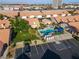 Aerial view of the community pool, parking area and surrounding buildings at 305 Crosswind Way, Las Vegas, NV 89145
