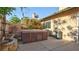 Enclosed backyard featuring a hot tub, patio and block wall at 305 Crosswind Way, Las Vegas, NV 89145