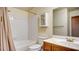 Bathroom featuring a tub/shower combo, vanity, mirror, medicine cabinet and toilet at 305 Crosswind Way, Las Vegas, NV 89145